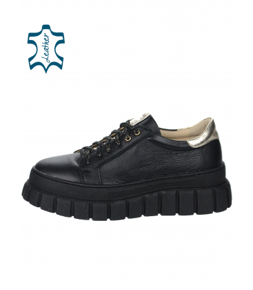 Black leather sneakers decorated with a gold strip on the sole ZUMA DTE3298