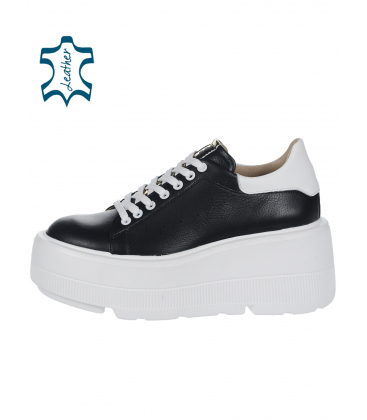 Black leather sneakers with a white heel on a white sole DTE N1016