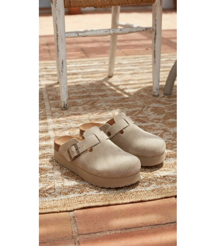Women's closed beige flip-flops with a higher sole