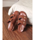 Brown summer flip-flops with decorations