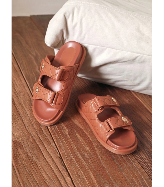 Brown summer flip-flops with decorations