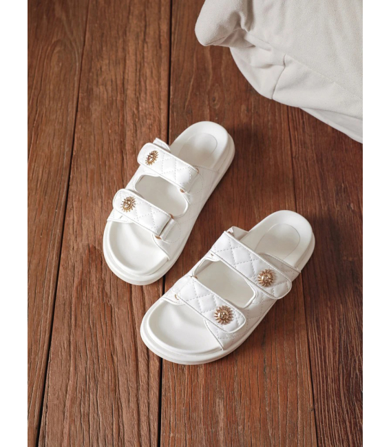 White summer flip-flops with decorations