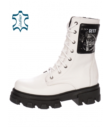 White comfortable ankle boots with an applique on the black HT250 sole 