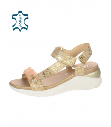Gold sandals with a delicate step pattern on a sports sole with an intertwined ornament 2362