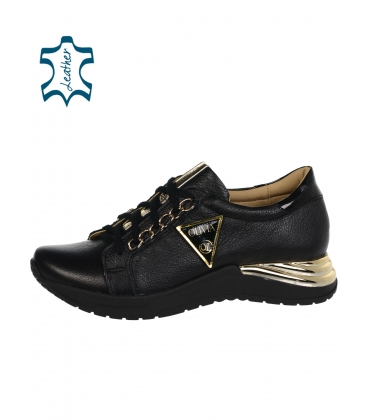 Black leather sneakers with the inscription OLIVIA on the side of the sole Flama DTE3500