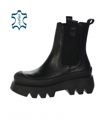 Black ankle boots with the inscription OLIVIA 004-105