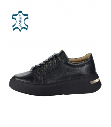Black leather sneakers with gold decoration on a black DAKA 8000 sole