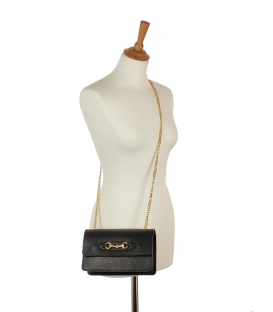 Leather black crossbody handbag with a chain and gold ornament Edita