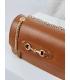 Leather brown crossbody handbag with a chain and gold ornament Edita